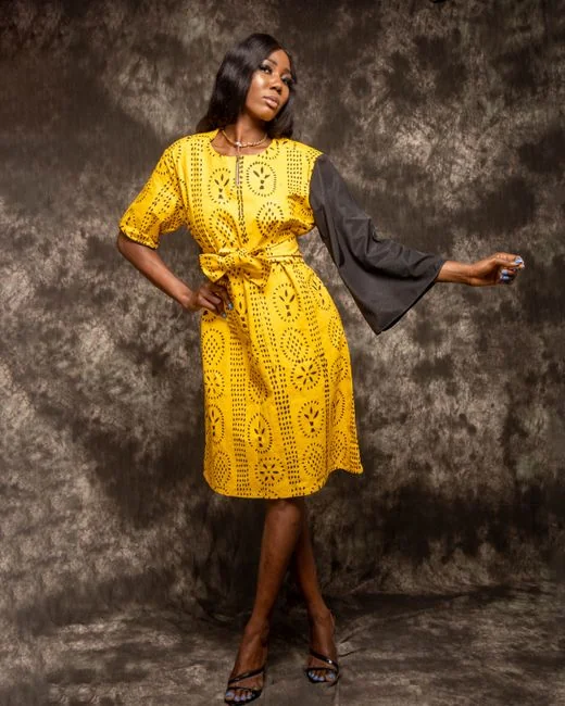 services-01 Tattooed hand holding a red book about design.